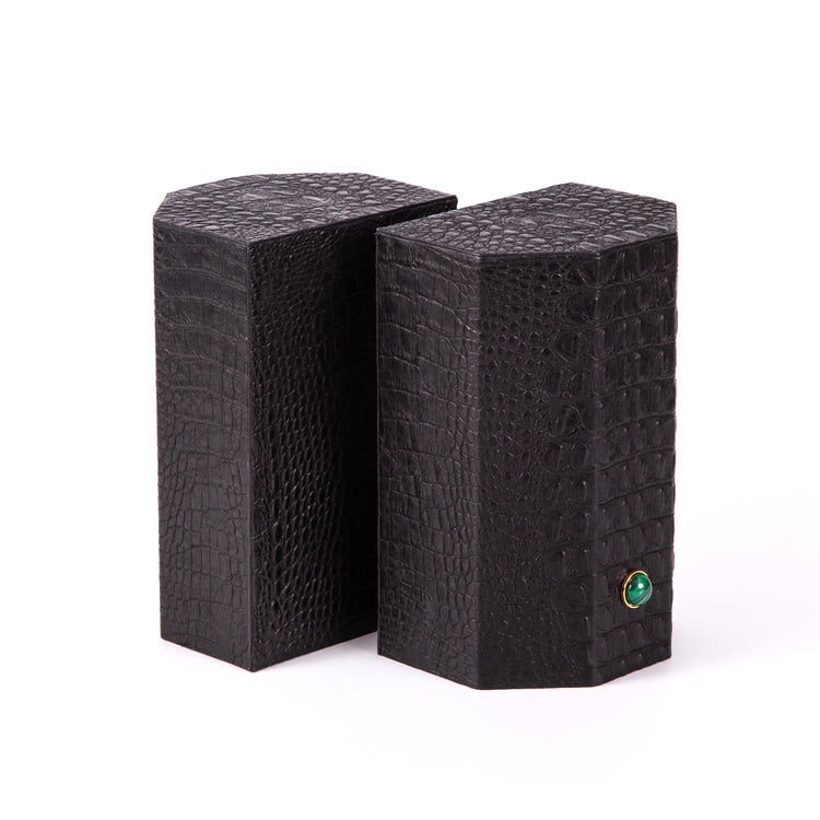 Croco bookends to add style and exotica to any library. Solid geometric blocks of wood covered in leather are the essential jewels on a bookshelf. %100 Leather (Embossed Croco) Jeweled with natural malachite stones