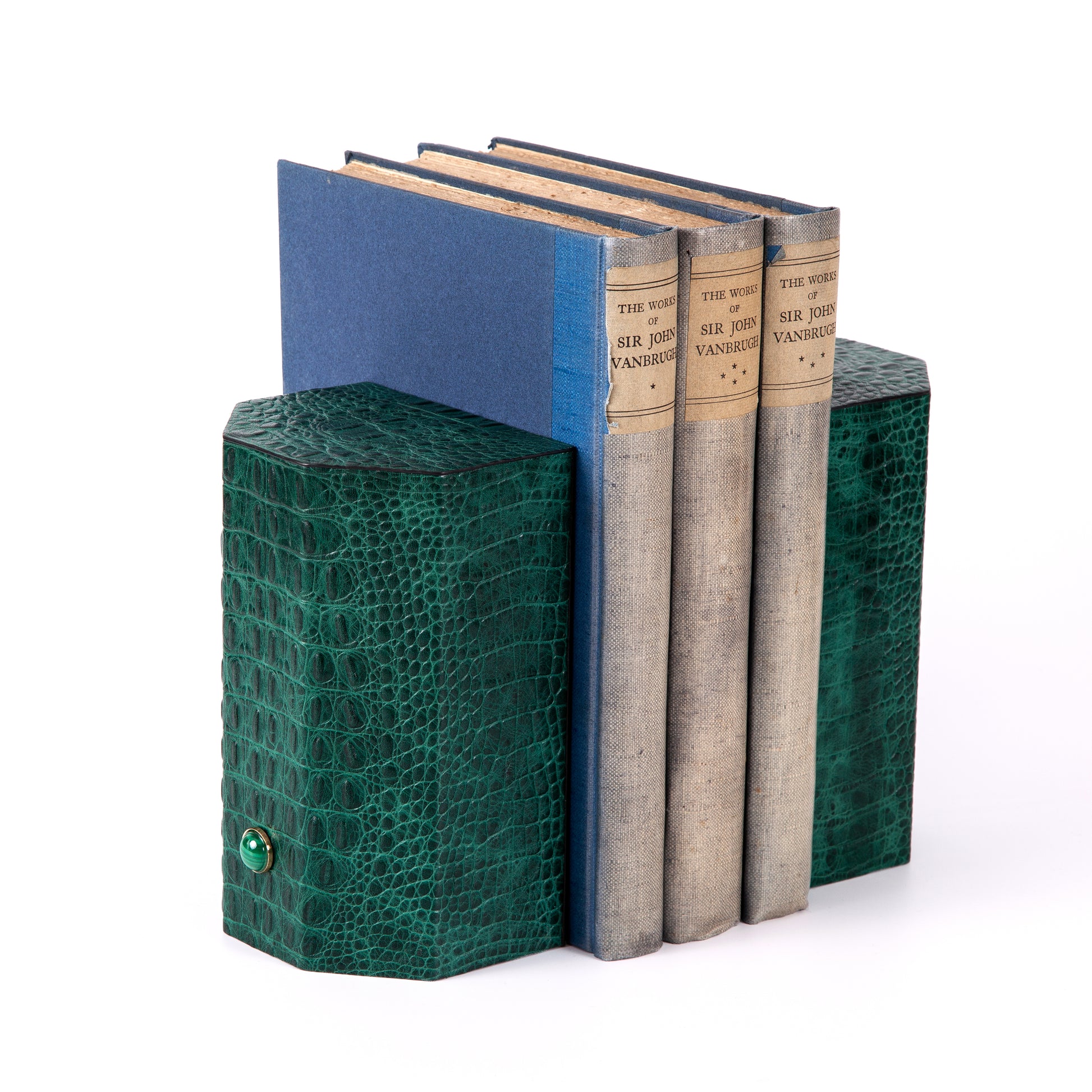 Croco bookends to add style and exotica to any library. Solid geometric blocks of wood covered in leather are the essential jewels on a bookshelf. %100 Leather (Embossed Croco) Jeweled with natural malachite stones