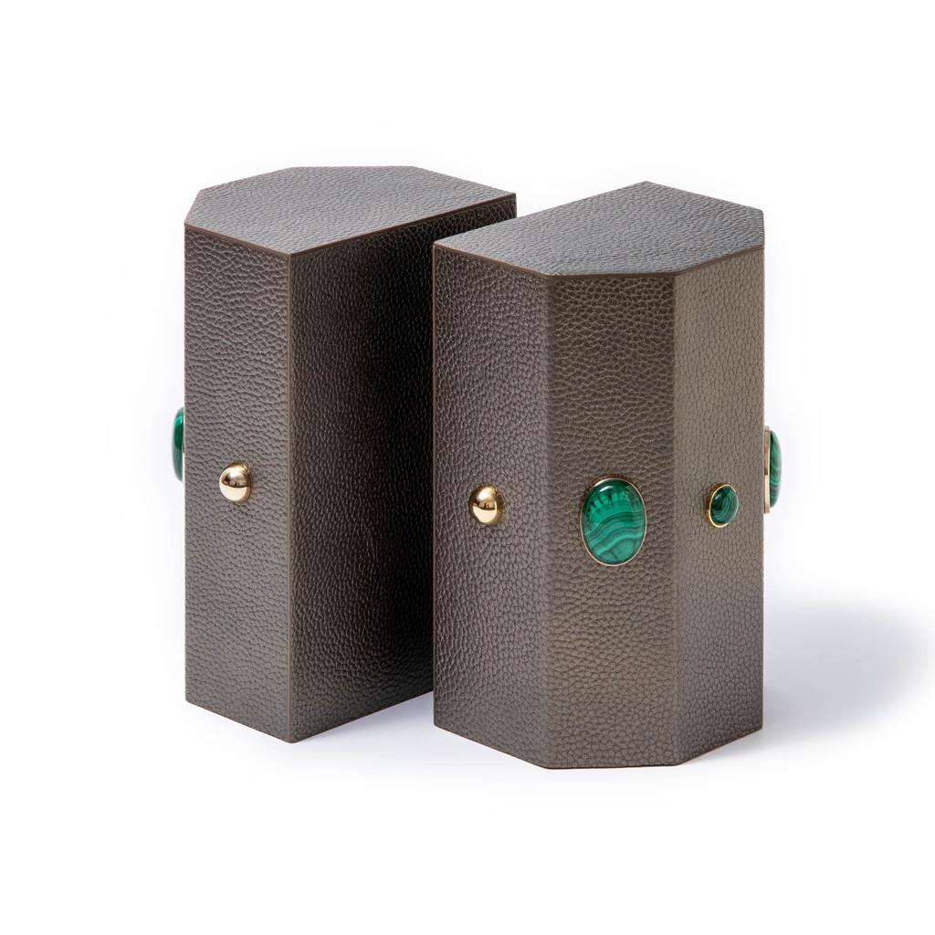 Madame Malachite A powerful protection stone, Black Onyx absorbs and transforms negative energy, wherever you may choose to keep it. Timeless and tasteful bookends jeweled with natural stones to increase the energy in you home. Perfect decorative pieces for for your cabinet of curiosities. %100 Leather (Floater leather)