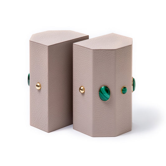 Madame Malachite A powerful protection stone, Black Onyx absorbs and transforms negative energy, wherever you may choose to keep it. Timeless and tasteful bookends jeweled with natural stones to increase the energy in you home. Perfect decorative pieces for for your cabinet of curiosities. %100 Leather (Floater leather)