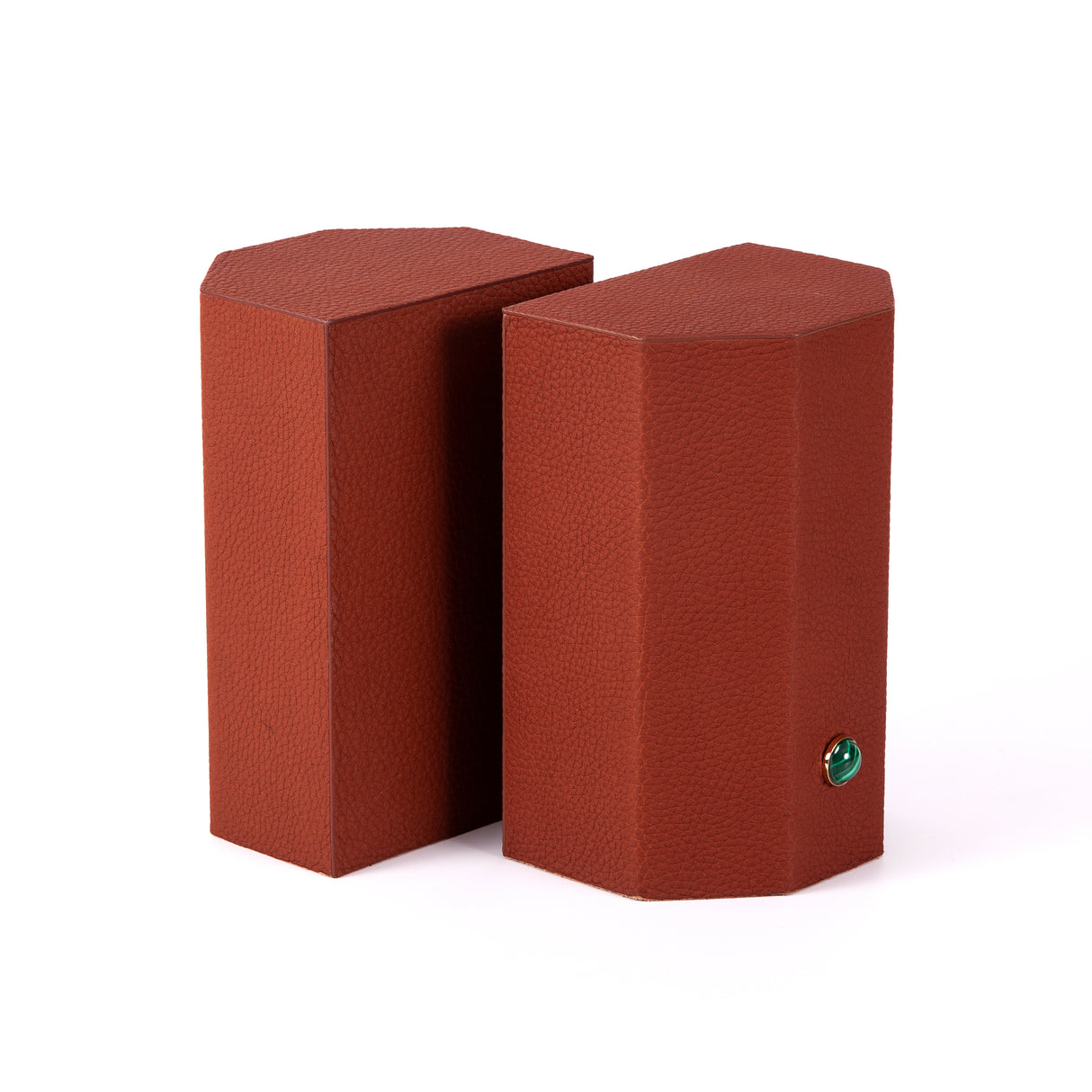 Timeless and tasteful bookends to add color to any library.  Solid geometric blocks of wood covered in leather are the essential jewels on a bookshelf.    Coordinate your bookends to match the decoration of the room.  %100 Leather (Floater leather)   Jeweled with natural malachite stones