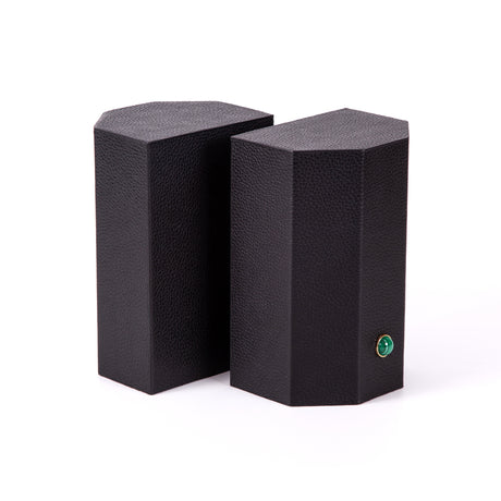 Timeless and tasteful bookends to add color to any library.  Solid geometric blocks of wood covered in leather are the essential jewels on a bookshelf.    Coordinate your bookends to match the decoration of the room.  %100 Leather (Floater leather)   Jeweled with natural malachite stones