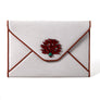 A canvas envelope trimmed with leather and sealed with a coral and malachite kiss!  Coral is believed to be endowed with mysterious sacred properties. It is a symbol of modesty, wisdom, and happiness.    Madame Malachite Design 
