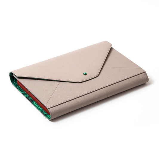 Madame Malachite A backgammon that you won't be able to leave home without!  In our signature envelope form, sealed with a malachite, our bestselling envelope backgammon is handcrafted with leather marquetry technique.