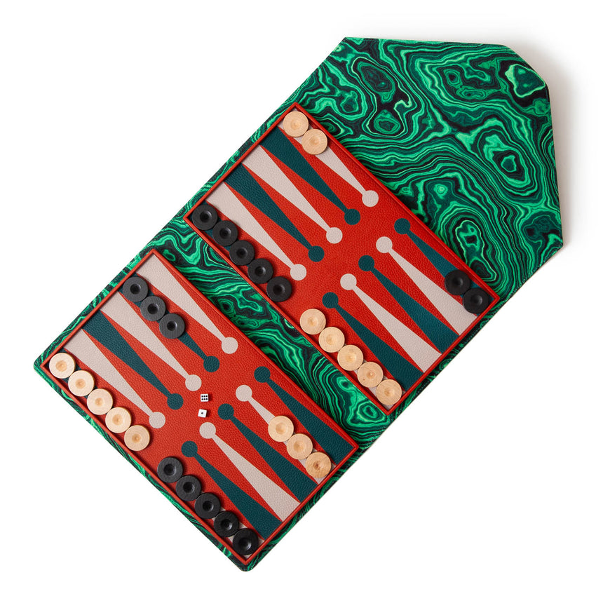 Madame Malachite A backgammon that you won't be able to leave home without!  In our signature envelope form, sealed with a malachite, our bestselling envelope backgammon is handcrafted with leather marquetry technique.  