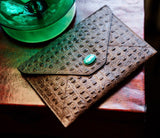 Envelopes of Madame Malachite sealed with her kiss, with our signature green malachite inner lining. Carry the magic of malachite everywhere you go.  %100 Embossed Leather   Jeweled with natural malachite stone, 24K gold plated