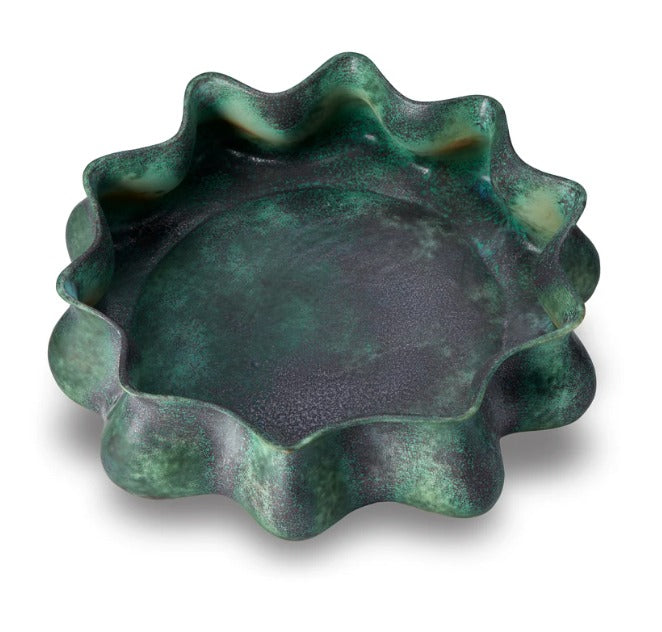 Inspired by the serene, reflective pools of light and color found in Tulum’s famous cenotes, the Cenote bowl is created by applying layered reactive glazes onto fine porcelain