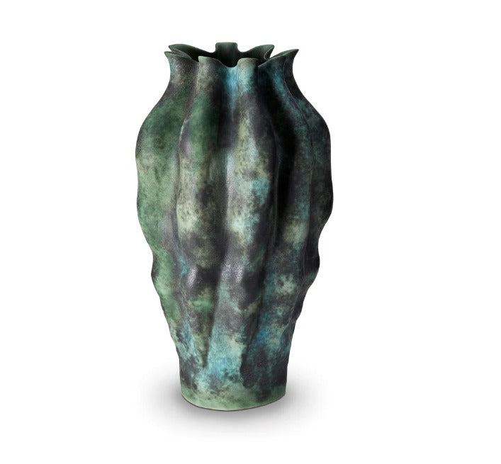 Inspired by the serene, reflective pools of light and color found in Tulum’s famous cenotes, the Cenote vase is created by applying layered reactive glazes onto fine porcelain
