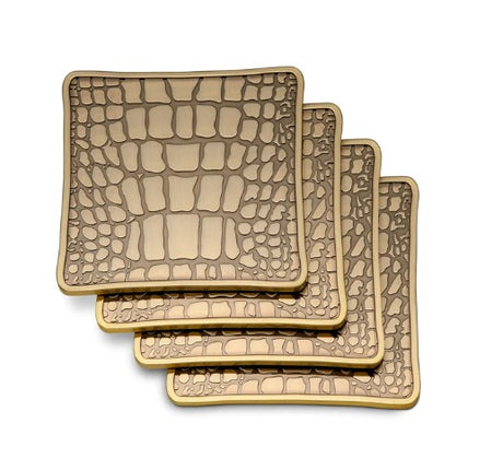 Meticulously handcrafted in antiqued brass, L'OBJET Crocodile Coasters are rich in natural texture and global in design  4 L x 4 W in (10 D cm) Presented in a luxury gift box Set of 4 Brass