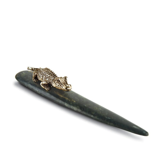 Meticulously handcrafted with 24k gold plating and outfitted with glass with 7x magnification, our Crocodile Letter Opener completes a whimsical desktop collection that is complex in color, rich in texture and global in design L'OBJET 