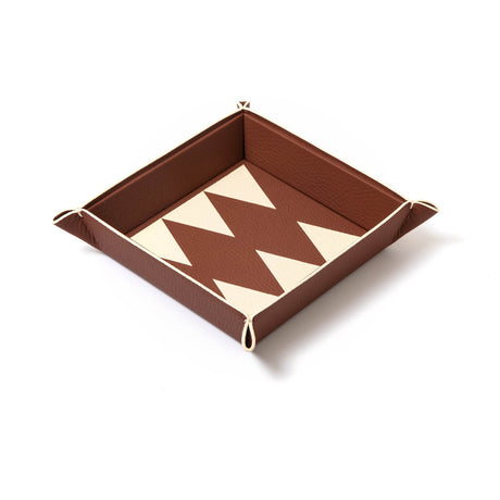 Vide poche trays meant to lighten up your load, and give you joy wherever you choose to place them.    100% Leather