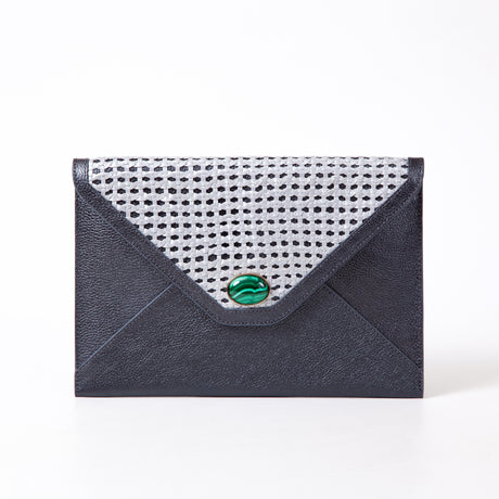Envelopes of Madame Malachite sealed with her kiss, lined with our signature malachite fabric. Carry the magic of malachite everywhere you go.  %100 Leather with handwoven leather   Jeweled with natural malachite stone, 24K gold plated